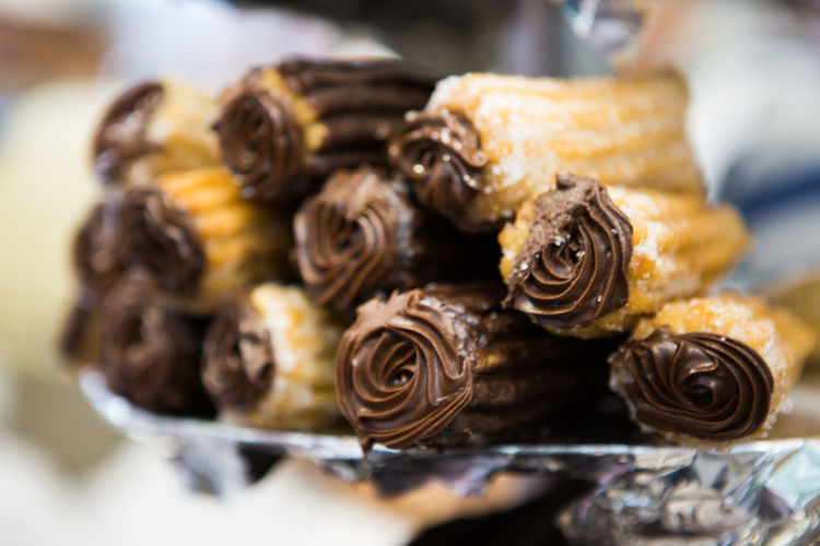 Close-up of chocolate cream with churros