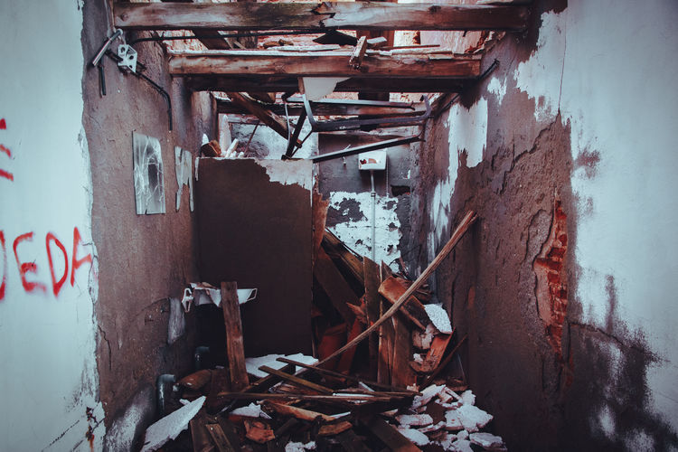 Abandoned building against wall