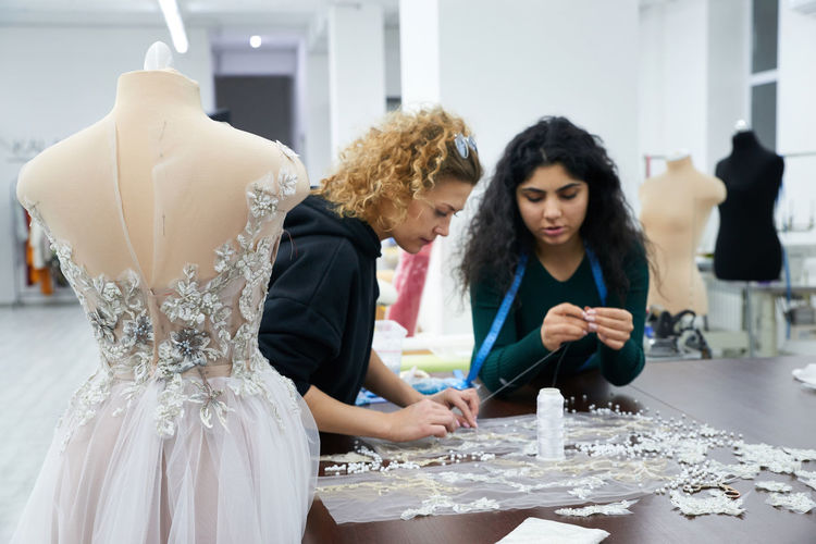  fashion designers working at workshop