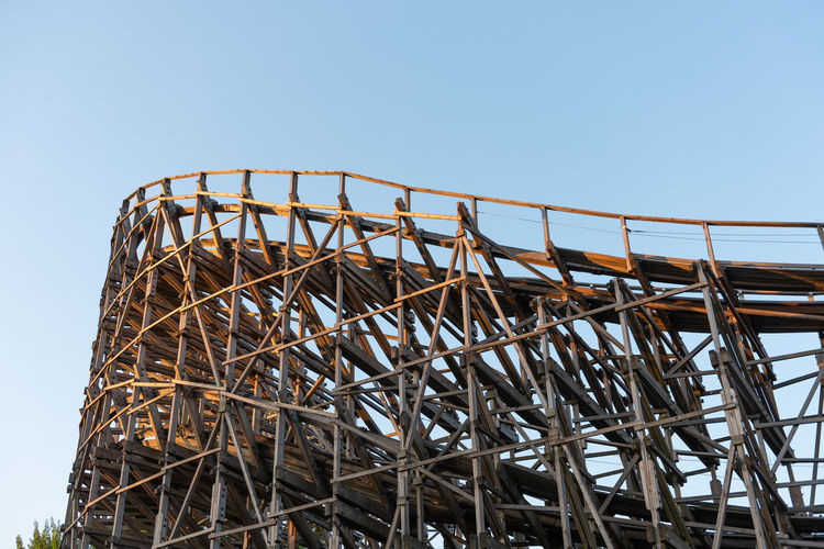 Curve of a large wooden roller coaster
