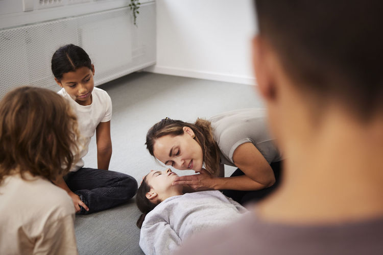 Teacher giving first aid training