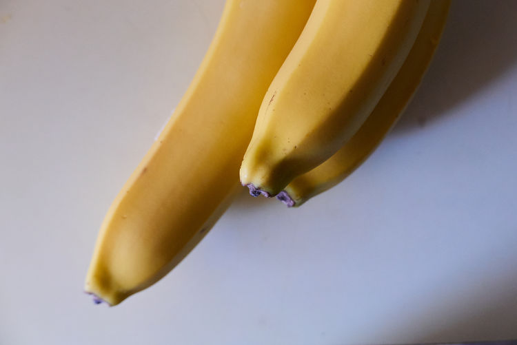 Close-up of lemon slice over white background