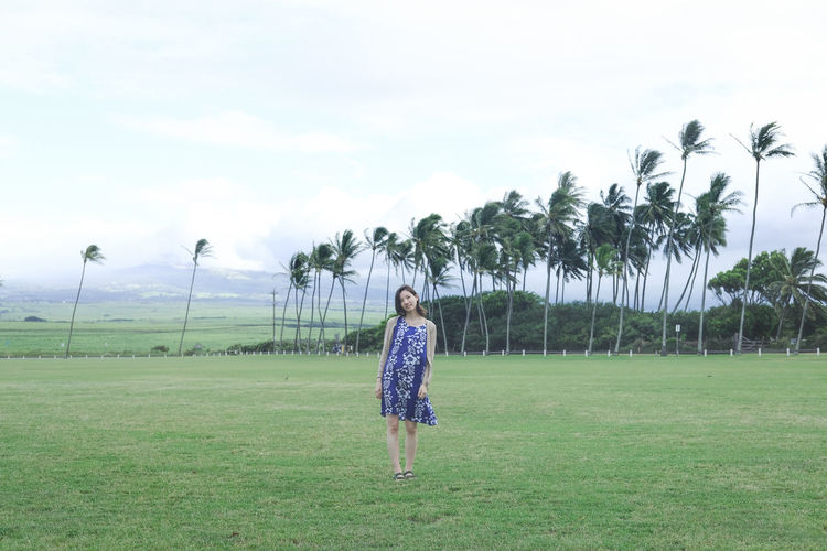 Full length of woman on field against sky