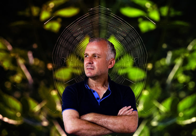 Close-up of man standing against tree
