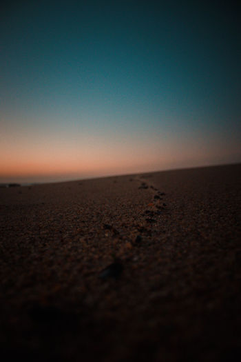 Scenic view of sea against clear sky during sunset