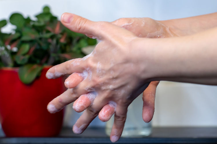 Close-up of person hand in water