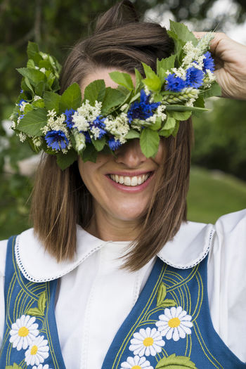 Woman wearing wreath of flowers