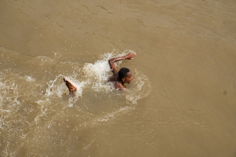 High angle view of man swimming in sea