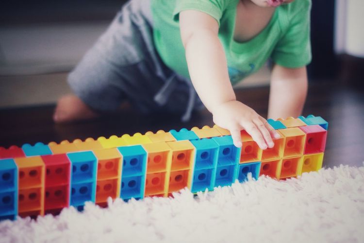 Boy playing with toy at home