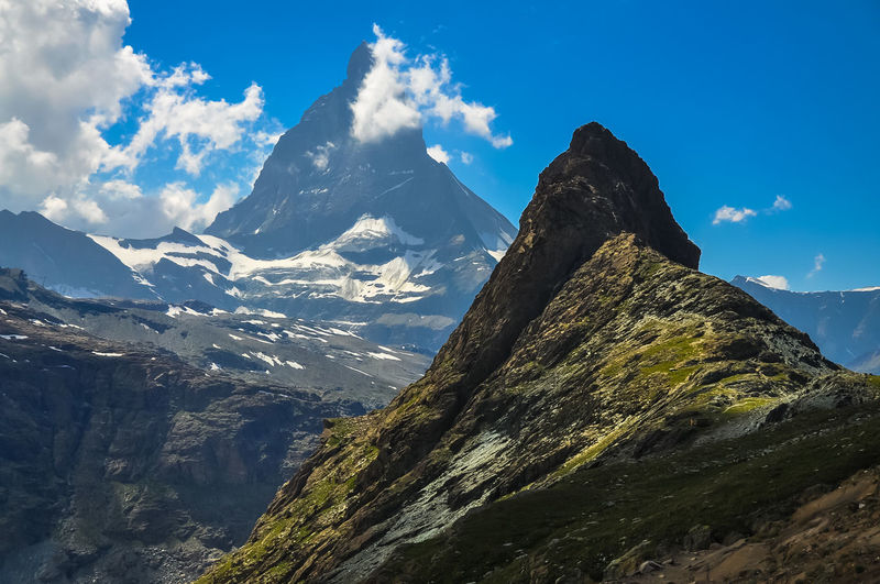 Scenic view of snowcapped mountains against sky