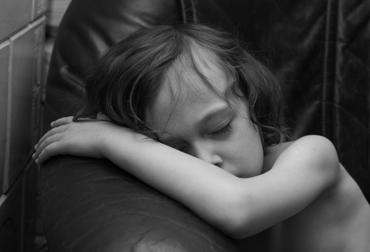 Portrait of cute kid relaxing on sofa