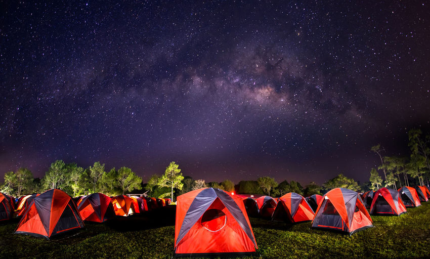 High angle view of tents against on field against star field at night