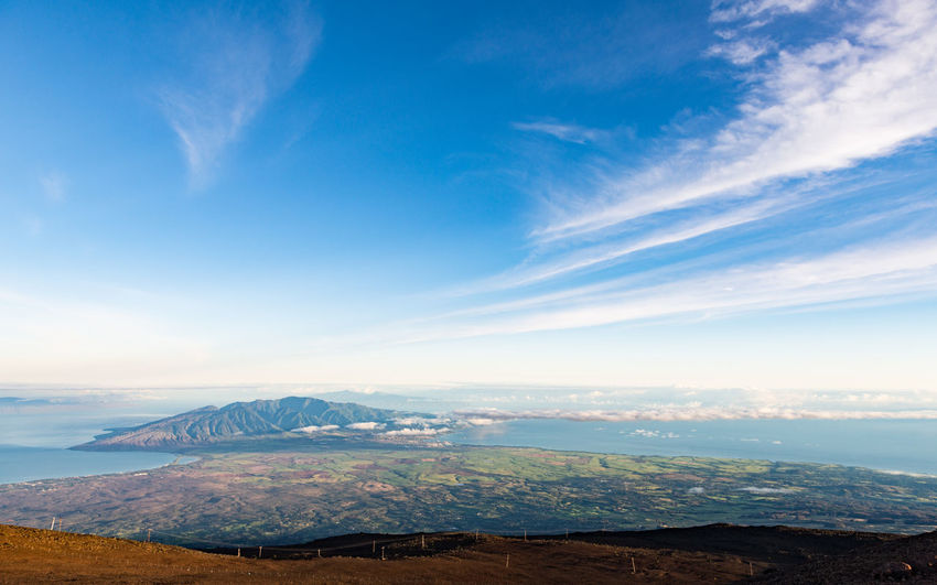 Scenic view of landscape against blue sky