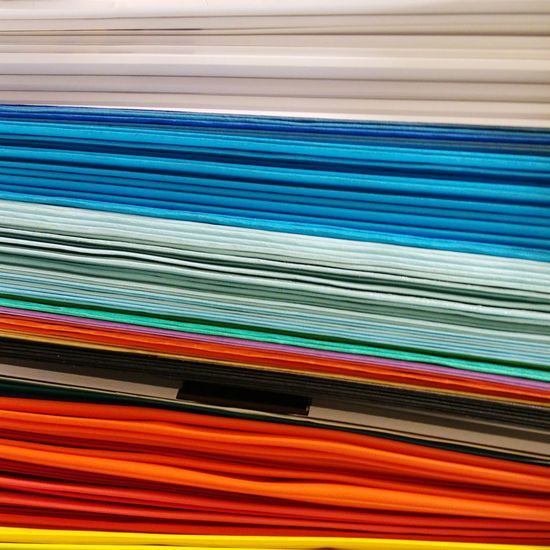Full frame shot of colorful stacked papers