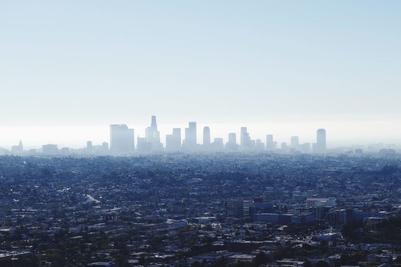 High angle shot of cityscape against clear sky