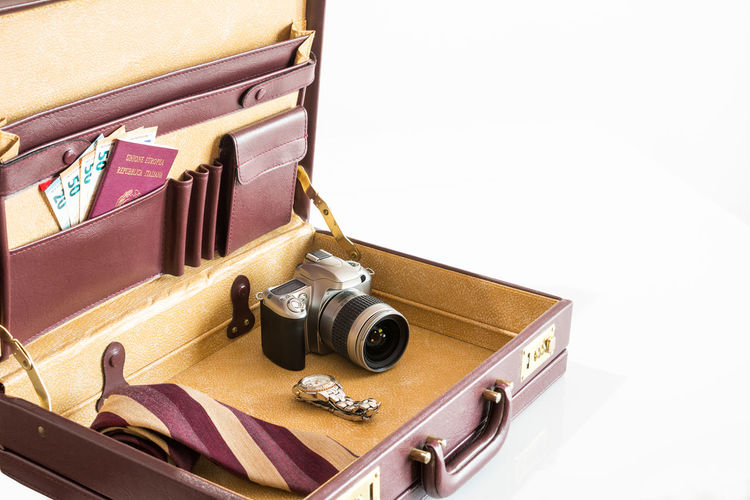 High angle view of camera on table against white background