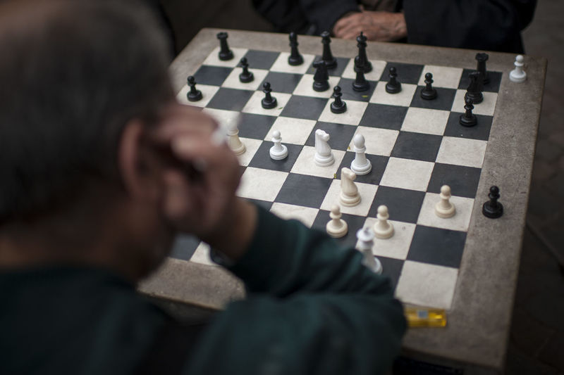 High angle view of man playing chess