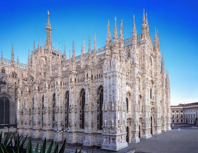Duomo di milano against clear blue sky in city