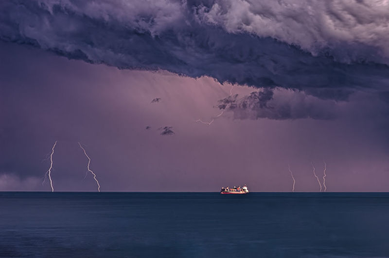Storm with lightning and ship on the mediterranean sea
