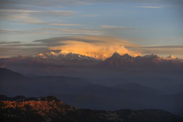 Scenic view of silhouette mountains against sky during sunset