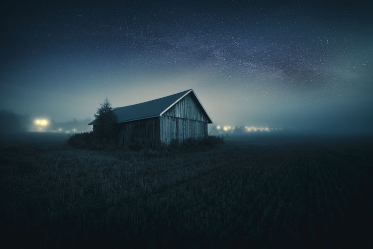 Scenic view of landscape against sky at night
