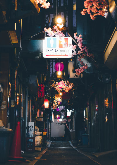 Illuminated lanterns hanging in city at night