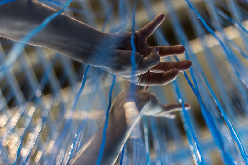 Close-up of man hand holding wire