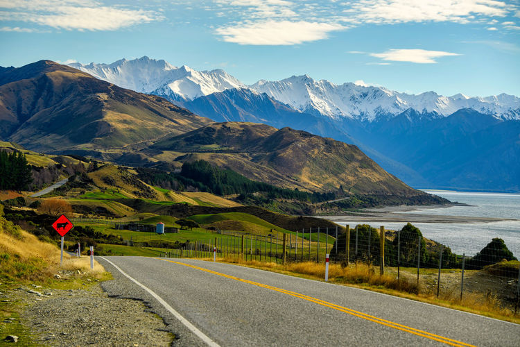 Road by mountains against sky at lake pukaki in southen island in newzealand