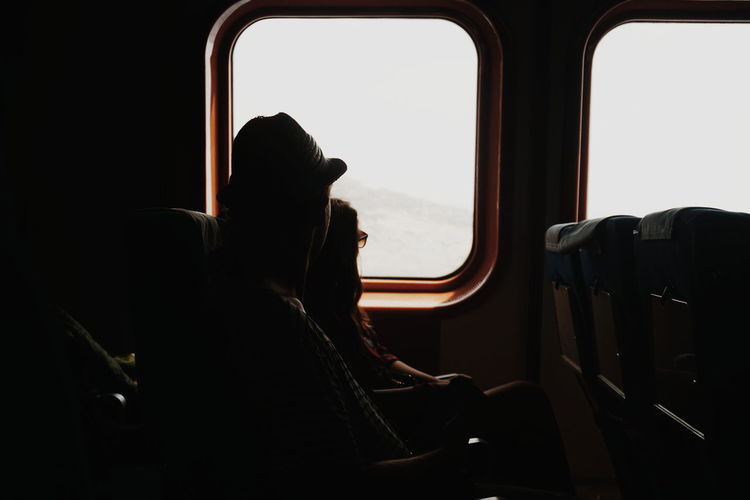 Couple sitting in train