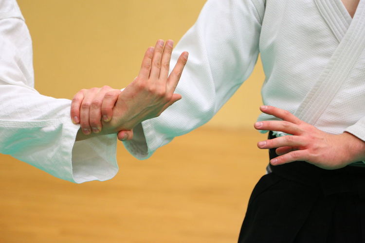 Close-up of people practicing martial arts