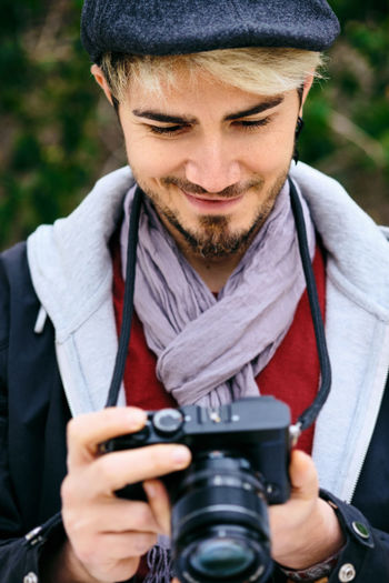 Portrait of man photographing