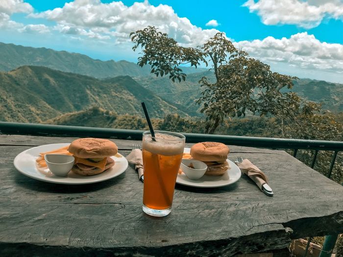 Breakfast on table against mountains