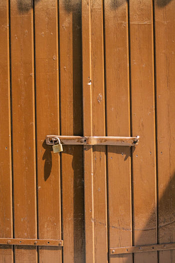 Full frame shot of closed brown wooden door