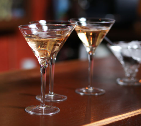 Close-up of drinks on wooden table