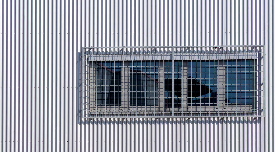 Full frame shot of window on wall of building