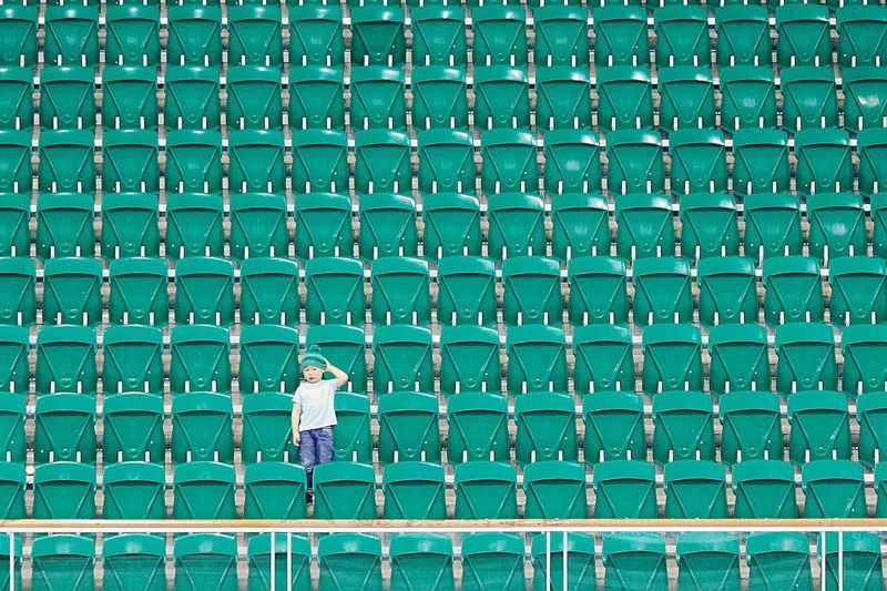 Portrait of a boy against green stairs
