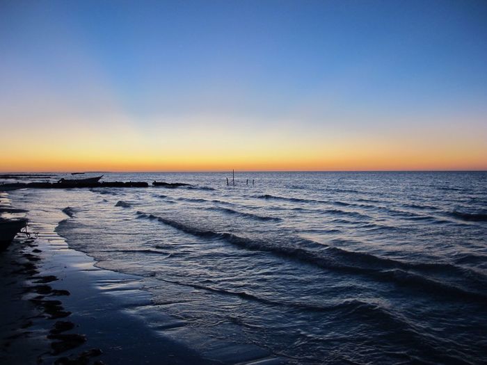 Scenic view of sea at sunset