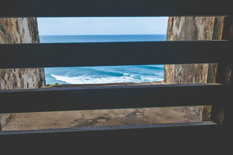 Scenic view of sea seen through window