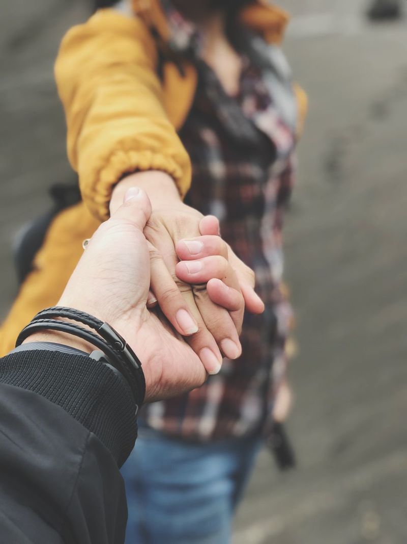 boyfriend and girlfriend holding hands