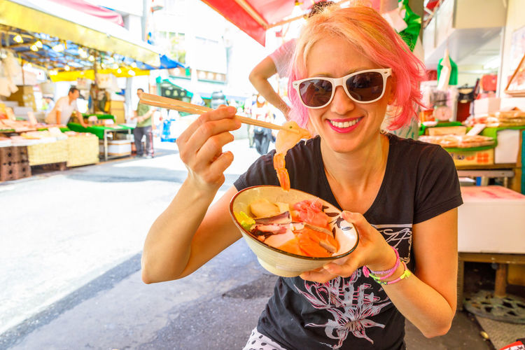Young woman eating ice cream