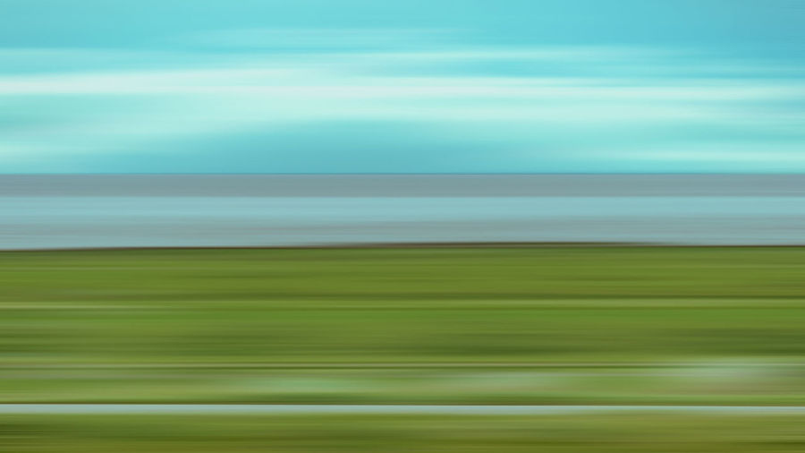 Full frame shot of green land against sky