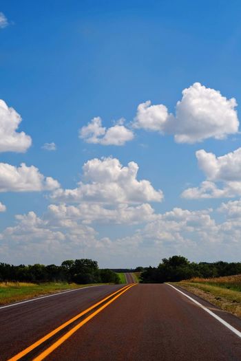 Empty road against sky