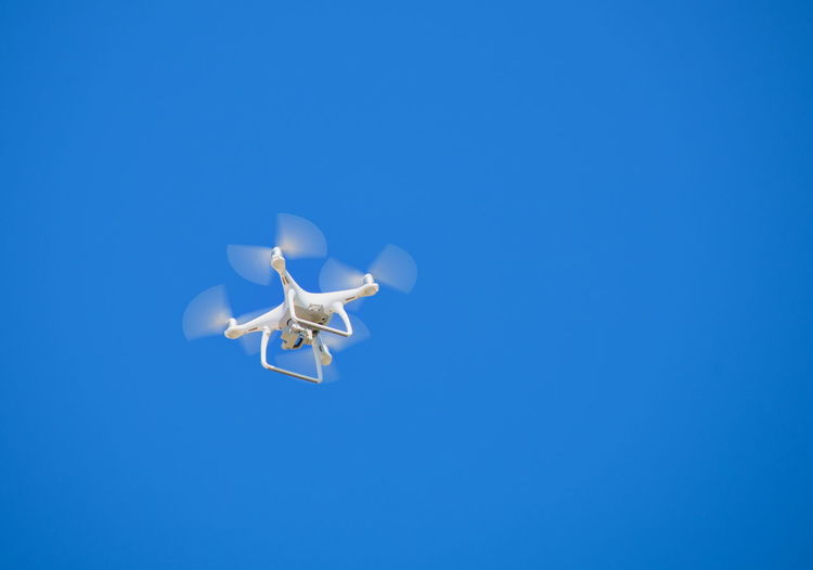 Drone flying in the clear blue sky