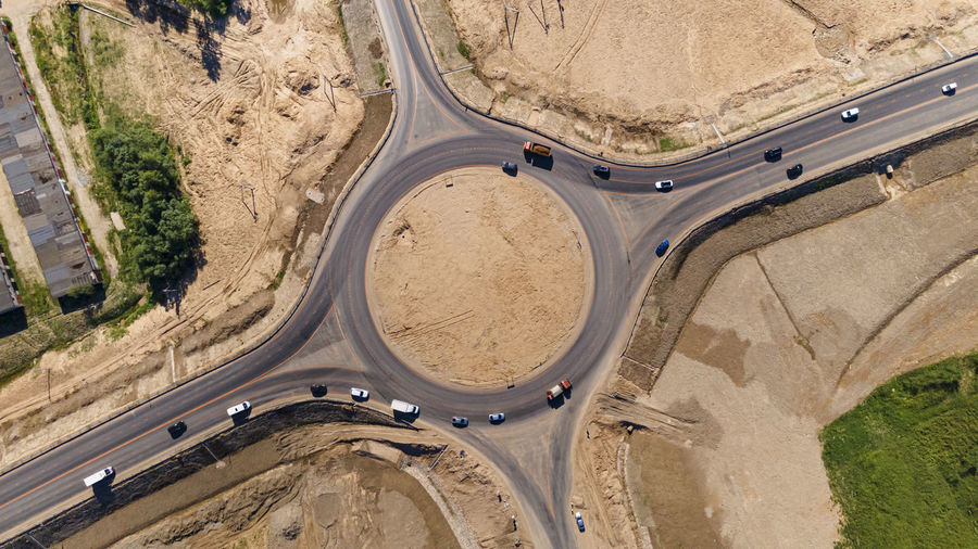 Top down aerial view of a traffic roundabout. road construction business.
