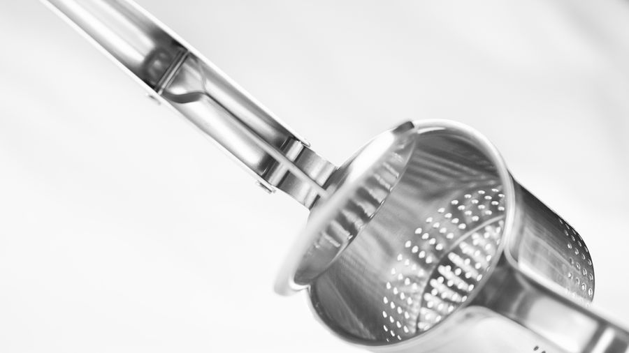 Cropped image of strainer against white background
