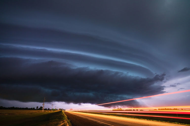 Supercell thunderstorm with light trails during a severe weather outbreak in kansas. 