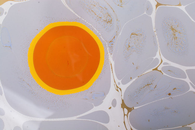 High angle view of yellow paint on water