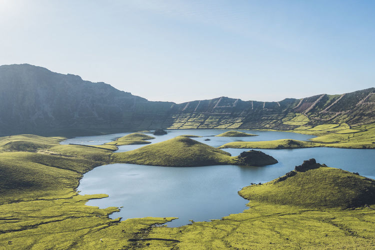 Tranquil scene of lake amidst mountain corvo, azores, portugal