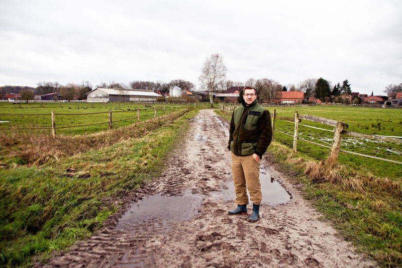 Portrait of man standing on farm