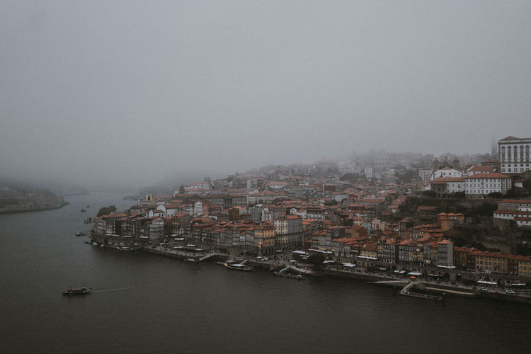 High angle view of buildings in city against sky